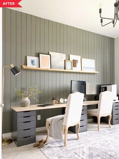 a desk with two chairs and a computer on top of it in front of a gray wall