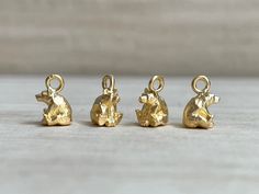 Despite its SUPER TINY size, this adorable bear charm showcases intricate features that bring it to life.  It is perfect for jewelry making.  It also comes with various attachment options, allowing it to be used as a pendant, clip on charm or bracelet charm. It's a delightful accessory for yourself or a thoughtful gift for your friends. DETAILS: ❇️ Material : brass ❇️ Treatment: matt gold plated ❇️ Size (excludes loop): H6.5 x W5 mm ❇️ Quantity: 1 piece ❇️Country of Origin: Japan ❇️ Attachments: Bear Jewelry, Carved Pendant, Clip On Charms, Animal Pendant, Bear Necklace, Bear Pendant, Jewelry Lookbook, Gift For Kids, Jewelry Inspo