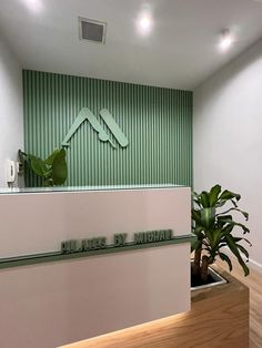 an office lobby with green and white walls