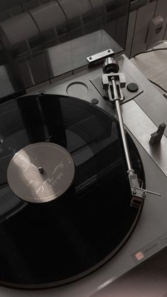 an old record player is sitting on the table