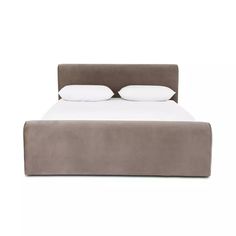 a large bed with two pillows on top of it's headboard and foot board