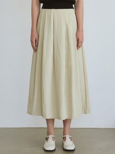 This is a long skirt with a flare line, offering a breezy and cool feel with its smooth material that rustles gently against the body, providing a natural silhouette.- Maxi length allowing for easy wear- Enhanced with lining and side pockets for practicality- The overall design punctuated with multiple pintuck details Neutral Flowy Lined Skirt, Flowy Wide Hem Maxi Skirt, Neutral Midi Skirt With Lined Detail, Chic Flowy Maxi Skirt With Wide Hem, Chic Flowy Skirt With Wide Hem, Neutral Midi Skirt With Lining, Chic Maxi Skirt With Wide Hem, Relaxed Wide Hem Maxi Skirt For Summer, Beige Lined Flowy Skirt