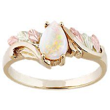 Treat yourself to the nature-inspired elegance of Black Hills Gold Tear Drop Oval Ring for Ladies. Crafted with 10K gold with a pear-shaped 8x5mm genuine opal cabochon at its center, this women's ring comes alive with colorful accents of 12K rose and green leaves. Convex-cut gemstone comes highly polished to a beautiful smoothness. Black Hills Gold Tear Drop Oval Ring measures approximately .38" wide. Made in USA.Manufacturer model #: GC40483L-CB. \u000a \u000a Crafted with 10K gold  \u000a Pear Satin Packaging, Ladies Gold Rings, Gold Drawing, Black Hills Gold Rings, Black Hills Gold Jewelry, 10k Gold Ring, Opal Ring Gold, Black Hills Gold, Jewelry Black