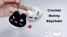 two crocheted keychains are being held up by someone's hand