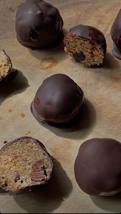 chocolate covered candies are arranged on a piece of parchment paper and ready to be eaten