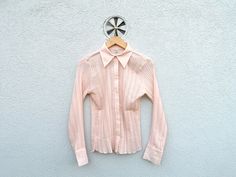 Vintage 1970s Light Rose Pleated Blouse ,slim fit,  transparent and in perfect condition! Size on tag: D/NL - 38 ; B/F - 40 ; E - 42 ; I - 44 Estimated fit: medium, please also check measures! FLAT MEASUREMENTS  Shoulders: 38 cm - 15'' Pit to pit: 44 cm- 17'' Sleeves: 59 cm - 23'' Length from collar on back: 61 cm - 24'' New drop daily!  Add my store to Favorites and Follow my Shop for new items. DELIVERY: For new updates on delivery please see my Shops front page! Thank you for consideration an Fitted Vintage Pink Blouse, Fitted Retro Pink Blouse, Vintage Pink Tops For Work, Retro Fitted Shirt For Daywear, Vintage Pink Shirt, Chic Shirts, Preppy Chic, Pleated Shirt, Light Rose