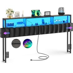 a computer desk with blue lights on it