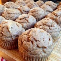 some muffins are sitting on a cutting board