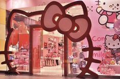 a hello kitty store with pink walls and windows