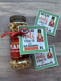 three jars filled with nuts and some cards on top of the jar that says we go nuts