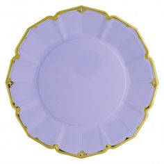 a purple and gold plate with scalloped edges on a white background, top view