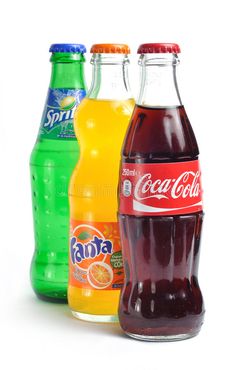 three bottles of soda and orange juice on a white background stock images, royalty photos