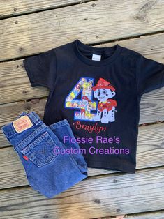 "Personalized Embroidered Paw Patrol Birthday Shirt. This shirt would be great for a birthday party, pictures, or as everyday wear for a special little one.  Due to holidays current Turnaround time is up to 14 business days THIS DOES NOT including shipping time I have a rush, my order listing if you need it sooner.  RUSH MY ORDER Need it quicker? I offer  \"RUSH MY ORDER\" which puts you in top of queue line and also upgrades your shipping to priority. Follow link and just add this to your cart  https://etsy.me/3kzJtGb The listing pictures are shirts I've completed.  Do understand that fabric placement in the number is not guaranteed to have a certain dog or a whole dog in it.  The design is embroidered, meaning it is stitched into the shirt for great quality and durability. If you have an Paw Patrol Birthday Shirt, Paw Patrol Shirt, Paw Patrol Characters, Police Dog, Embroidered Dog, Group Of Dogs, Paw Patrol Birthday, Police Dogs, Group Shirts