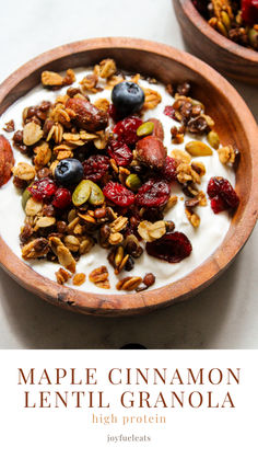 maple cinnamon lentil granola in a bowl with yogurt and berries on top