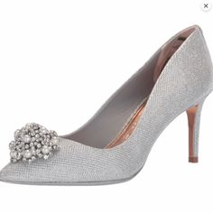 Ted Baker Darlill Metallic Brooch Silver Heel Pump Channel Your Inner Cinderella In The Darlill Courts. Adorned With A Lavish Brooch Embellishment On The Toe And Featuring A Metallic Sheen. Diamante Brooch Detail Metallic Pointed Toe Lining On Sole Upper: 100% Polyester; Lining: 80% Ovine Leather, 20% Polyester; Sock: 100% Ovine Leather; Sole: 100% Resin Size 37 (Us 6.5) Ted Baker Heels, Gold Shoes Heels, Floral High Heels, Ted Baker Shoes, Butterfly Heels, Silver Heel, Sequin Heels, Flower Heels, Embellished Heels