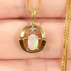 Radiant And Alluring Petite Vintage Pendant! Featuring A Colorful 6x4mm Oval Shaped Solid Australian White Opal Cabochon, With Lots Of Blues, Greens, And A Bit Of Violet (Possibly Lab Created), And One 0.01 Carat Diamond Accent; Set In 14k Solid Yellow Gold. New 18” 0.8mm Gold Vermeil (14k Plated Over Sterling Silver) Box Chain Included! The Pendant Is Unmarked, But Acid Tested As Solid 14k Gold. The Pendant Measures 17x10mm The Pendant Weighs 1.53g Vintage Condition: Good/Very Good (Some Minor Setting Ideas, Gold Circle, Silver Box, Vintage Pendant, Opal Necklace, Circle Pendant, White Opal, Box Chain, Solid Yellow