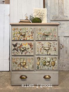 an old dresser is decorated with many different things and has been painted on the drawers