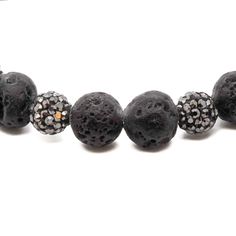 The Black Crystal Bracelet is a stunning and versatile handmade piece that can be worn with any outfit. Featuring black lava rock and crystal beads, this handmade bracelet has a natural and earthy feel while also offering the benefits of crystal energy. The silver plated Swarovski charm adds a touch of elegance and sparkle to the design, making it perfect for dressing up or down.The Black Crystal Bracelet is not only stylish, but also has spiritual benefits. The black lava rock stone beads are b Crystal Energy, Lava Rock, Old Stone, Unique Bracelets, Lava Stone, Energy Crystals, Handmade Bracelet, Crystal Bracelet, Stone Rocks