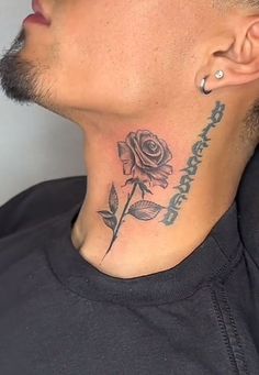 a man with a rose tattoo on his neck