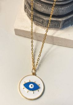 White evil eye necklace, round-shaped, stainless steel gold colour. Charm necklace for summer:) Trendy Gold Plated Round Necklace, Trendy Gold Circular Necklace, Trendy Gold Circle Necklace, White Round Pendant Necklace In Stainless Steel, White Stainless Steel Necklace With Round Pendant, Gold Circle Stainless Steel Necklace, White Stainless Steel Round Pendant Necklace, Yellow Gold Evil Eye Round Necklace, White Gold Plated Round Charm Necklace