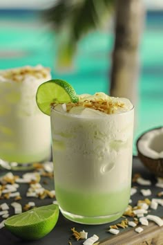 two margaritas with lime and coconut on a table