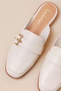 Upgrade your everyday flats with a chic new option like the Lulus Marquete Bone Buckle Mule Slides! These too-cute mules have a smooth, faux leather construction that shapes an almond toe upper and an adjustable strap with a gold buckle and matching grommets. Classic notched collar leads to a slide-on design for effortless styling. 0. 75" rubber heel. Cushioned insole. Rubber sole has nonskid markings. Man made materials. Imported. Lulus | Marquete Bone Buckle Mule Slides | Size 10. Spring Faux Leather Closed Toe Slip-ons, Chic Synthetic Flat Slip-ons, Spring Faux Leather Slip-ons, Spring Closed-toe Faux Leather Slip-ons, Chic Beige Flat Slip-ons, Chic Faux Leather Flats For Spring, Everyday Closed Toe Mules For Spring, Flat Mules For Office, Chic Slip-on Flats For Everyday