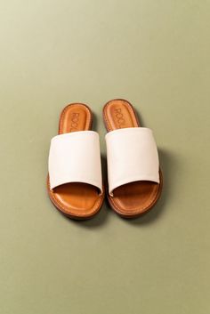 Cream Slip-on Sandals With Leather Sole, Beige Leather Closed Toe Footbed Sandals, Open Toe Beige Mules With Leather Footbed, Beige Open Toe Mules With Leather Footbed, Natural Leather Open Heel Mules, Cream Sandals With Rubber Sole For Beach, Beige Slide Sandals With Leather Footbed, Comfortable Natural Leather Sandals, Beige Leather Footbed Slide Sandals