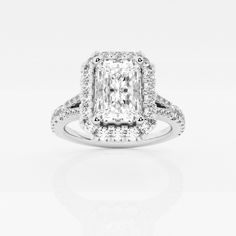 an engagement ring with a cushion cut diamond in the center