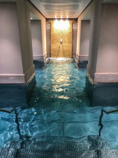 an indoor swimming pool with clear blue water