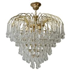 a chandelier with many crystal drops hanging from it