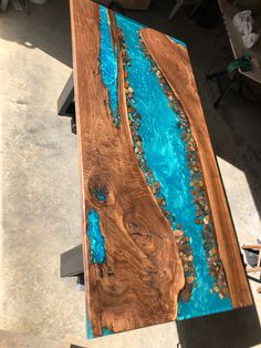 a wooden table with blue paint on it