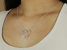 "Perfect holiday Gift. A beautiful pendant representation of grandmother, mom, and child OR father, mother, and child. OR three sisters OR best friends! Three Heart Necklace. - Delicate, high quality sterling silver chain and findings - Open heart pendent 23x 26mm - Made to order at the length you choose - Shown at 18\" on the model - Comes in a cute little package ready for gift giving. Please let me know if you want to include a custom message with your gift. { ADD ON } ♦ Lobster clasps: https Heart Necklaces For Mother's Day, Heart Pendant Necklace For Anniversary Gift, Open Heart Necklace For Anniversary, Heart Necklace For Mother's Day, Heart Necklace For Mother's Day Gift, Mother's Day Heart Charm Necklace, Mother's Day Double Heart Birthstone Necklace, Mother's Day Gift Heart Necklace, Heart Necklace With Birthstone As Gift For Mom