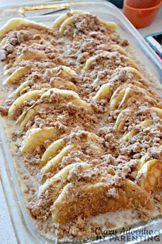 a casserole dish with bananas and powdered sugar on top, ready to be eaten