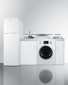 a white refrigerator freezer sitting next to a washing machine