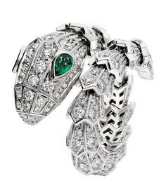 In tribute to the jeweller's reptilian muse, this Serpenti ring by Bvlgari is a radiant decoration for the hand. It articulates the sinuous body of a snake in 18-karat white gold, boasting a captivating snakehead motif – note the emerald eyes that mimic the magnetic power of a woman's gaze. Dating back to ancient Greek and Roman mythology, the snake represents wisdom, vitality and seduction, while the precious materials and pavé diamonds lend a distinguished sensuality to the wearer. Bvlgari Serpenti Ring, Snake Watch, Jewelry Animals, Bvlgari Ring, Emerald Eyes, Cartier Panthere