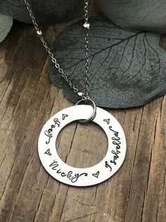 "This listing includes a 1 1/4\" stainless steel washer hand stamped stainless pendant with names up to a maximum of 25 letters, on your choice of either a stainless steel satellite (beaded) chain or plain chain. Please include in the message to seller section the name(s) to be stamped on the pendant. No more than a total of 25 letters. The names will be separated by a heart stamp. *Stainless Steel - Will not tarnish or change color. Its color is slightly darker than sterling silver & heavie Stainless Steel Charm Necklaces For Mother's Day, Mother's Day Stainless Steel Charm Necklace, Everyday Stainless Steel Charm Necklaces For Mother's Day, Everyday Stainless Steel Charm Necklace For Mother's Day, Hand Stamped Round Charm Necklace For Best Friend, Everyday Personalized Stainless Steel Charm Necklace, Everyday Hand Stamped Stainless Steel Jewelry, Hand Stamped Stainless Steel Jewelry For Best Friend, Personalized Round Stainless Steel Charm Necklaces