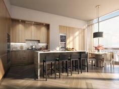 a large kitchen with wooden cabinets and bar stools