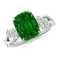 an emerald and diamond ring on a white background