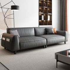 a modern living room with grey leather couches and coffee table in front of a large window