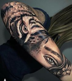 a woman with a tiger tattoo on her arm