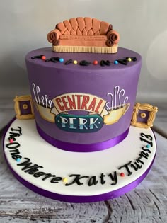 there is a purple cake with a crown on top