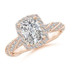 an engagement ring with a cushion cut diamond in the center and two rows of diamonds surrounding it