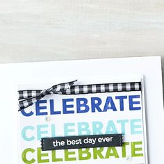 a card with the words celebrate on it