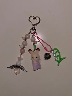 a key chain with charms attached to it