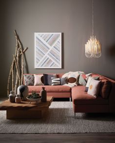 a living room filled with furniture and a large map hanging on the wall above it