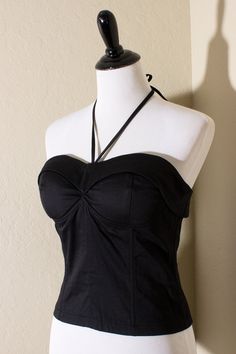 This stunning bustier top features black cotton fabric with padded cups, boning and elastic shirring on the back for a perfect fit! Zip up back with a cute V tie. Also did you notice the cute fold over bustline? 100% cotton with lining. Imported. Cute V, Black Cotton Fabric, Pop Style, Bustier Top, Edgy Outfits, Dream Clothes, Fold Over, Cute Tops, Black Cotton