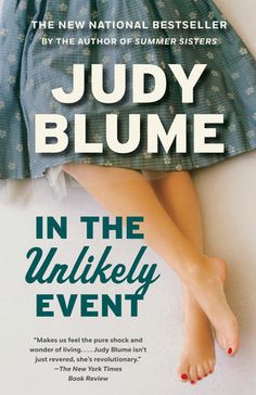 the cover of in the unlikely event by julia blume, with her feet propped up against the wall