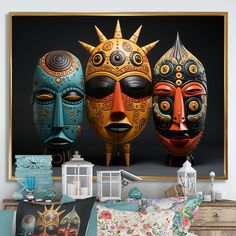 three colorful masks sitting next to each other in front of a black background with gold accents