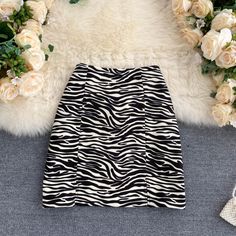 Look wild and stylish in this zebra-print mini-skirt! With an A-line high-waist design, this cute skirt is sure to be the talk of the town. Unleash your inner fashionista with Tiny Temptations Zebra Print Mini Skirt by Bella Chix! Product Specifications Silhouette: A-Line Pattern Type: Print Material: Polyester Fit Type: Regular Fit Fabric Type: Broadcloth Elasticity: Non-Stretch Length: Above Knee, Mini Kindly refer to the size chart before placing an order. Size Chart (in cm) Size Waist Length Chic Leopard Print Mini Skirt, Zebra Print Mini Skirt, Timeless Fashion Pieces, High Waist Mini Skirt, Empire Silhouette, Silk Satin Fabric, Print Mini Skirt, Talk Of The Town, Vintage Silhouette