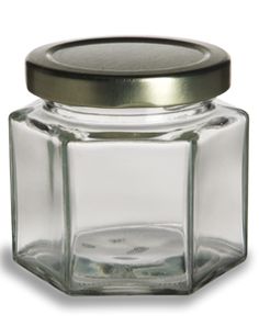 an empty glass jar with a metal lid